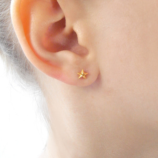 Tiny Star Stud Earrings Gold on Model