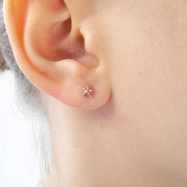 Tiny Star Stud Earrings Rose Gold on Model