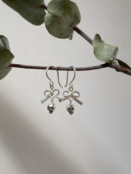 Tiny bow and skull hook earrings