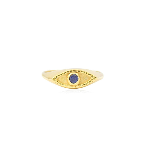 Gold ring with a purple gemstone on a white background