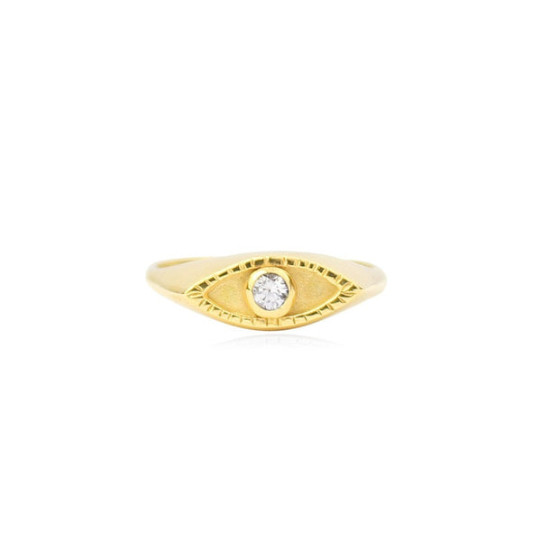 Gold ring with a diamond on a white background