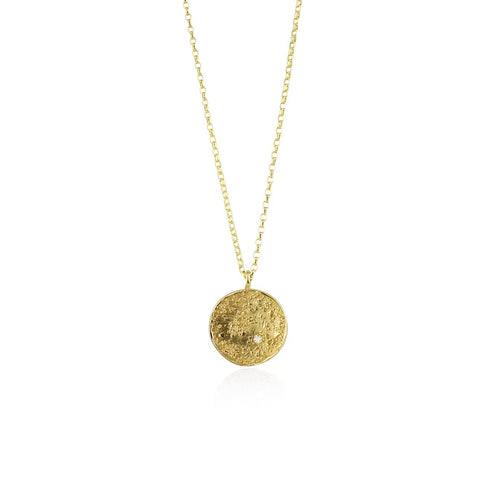 A 9k gold necklace with a textured circular pendant and a delicate flat trace chain, featuring a small diamond.