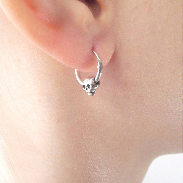 MOMOCREATURA Baby Skull Hoop Earrings Silver on Model