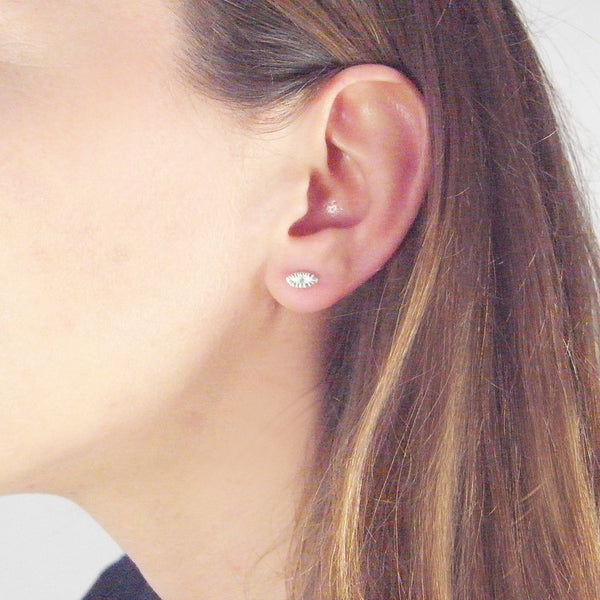 Tiny Eye Earrings Silver on Model 01