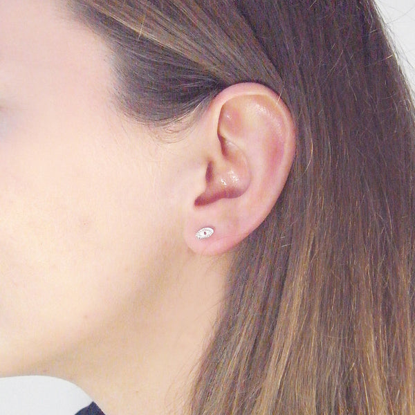 Tiny Eye Earrings Silver on Model 02